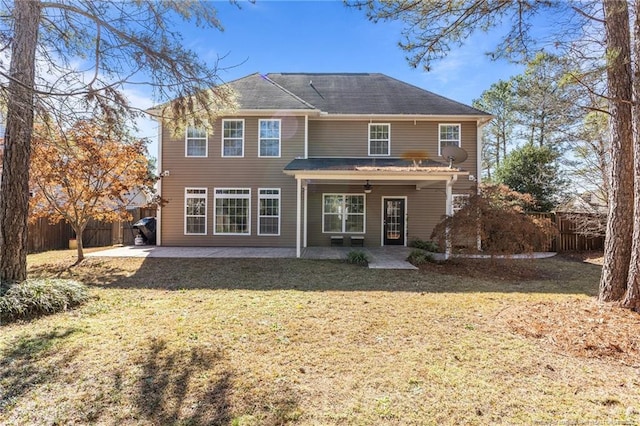 back of house with a patio area, ceiling fan, and a lawn