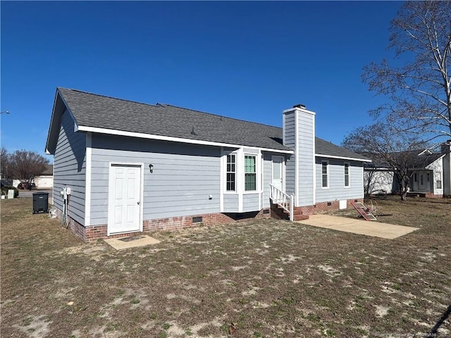 back of house featuring a yard and a patio