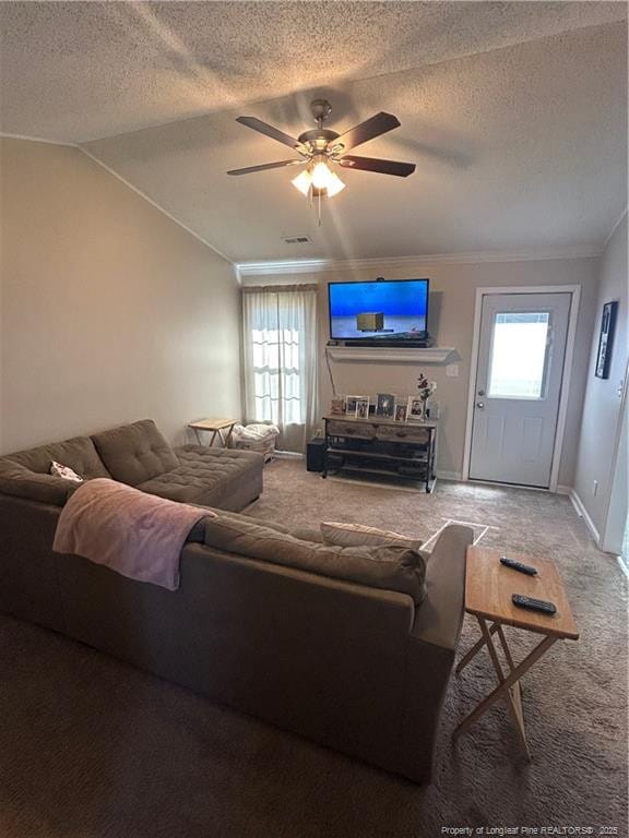 living room with lofted ceiling, carpet, ceiling fan, crown molding, and a textured ceiling