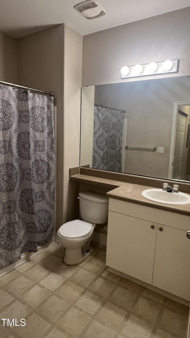 1828 Parkside Village Dr, Clayton, NC 27520 - bathroom featuring tile patterned floors, vanity, visible vents, and toilet