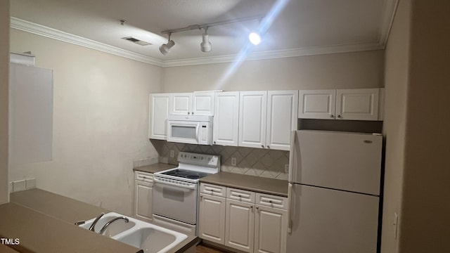 1828 Parkside Village Dr, Clayton, NC 27520 - kitchen with tasteful backsplash, visible vents, track lighting, a sink, and white appliances
