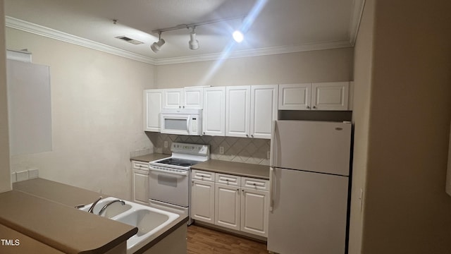 1828 Parkside Village Dr, Clayton, NC 27520 - kitchen featuring crown molding, white appliances, track lighting, white cabinets, and a sink