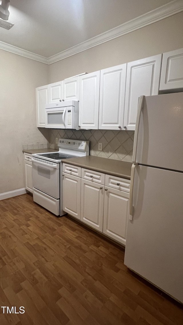 1828 Parkside Village Dr, Clayton, NC 27520 - kitchen featuring white appliances, white cabinetry, crown molding, visible vents, and decorative backsplash