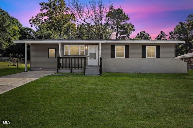 ranch-style home featuring a yard