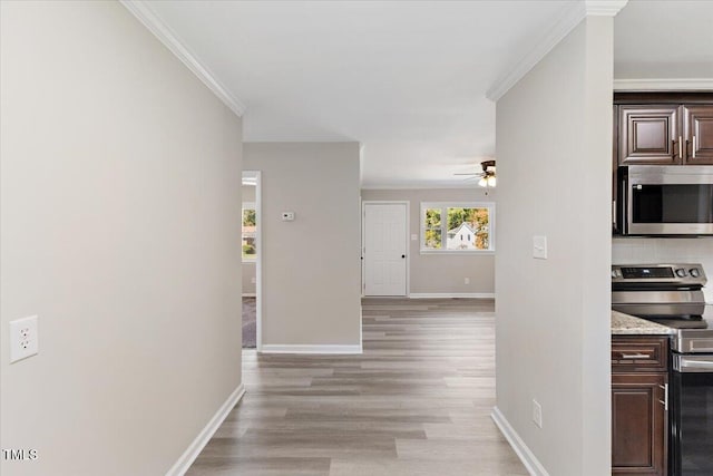 interior space with crown molding, dark brown cabinets, stainless steel appliances, and decorative backsplash