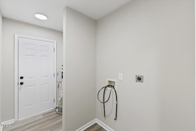 laundry room featuring washer hookup, hookup for an electric dryer, water heater, and light hardwood / wood-style flooring