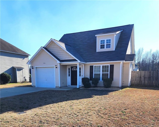 view of front of house with a garage and a front lawn