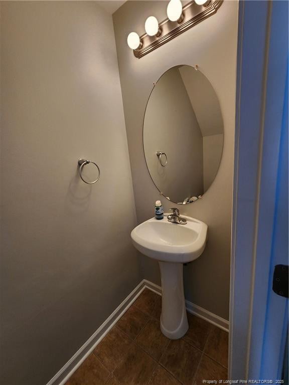 bathroom with tile patterned floors