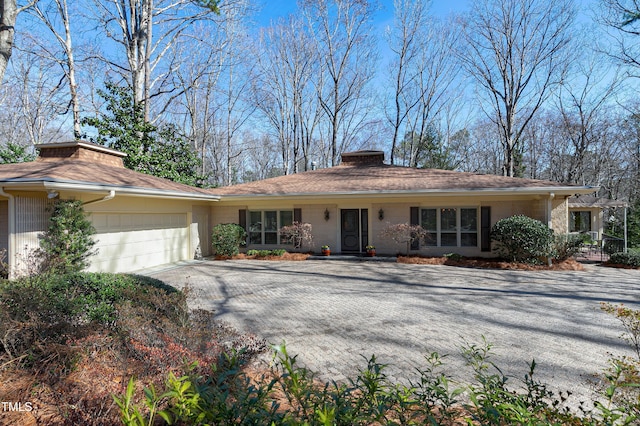 single story home featuring a garage