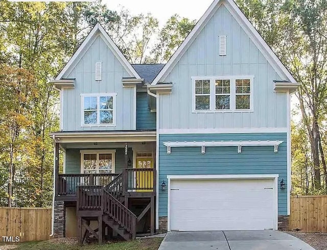 view of front of house featuring a porch and a garage