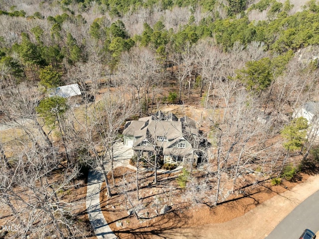 drone / aerial view featuring a view of trees