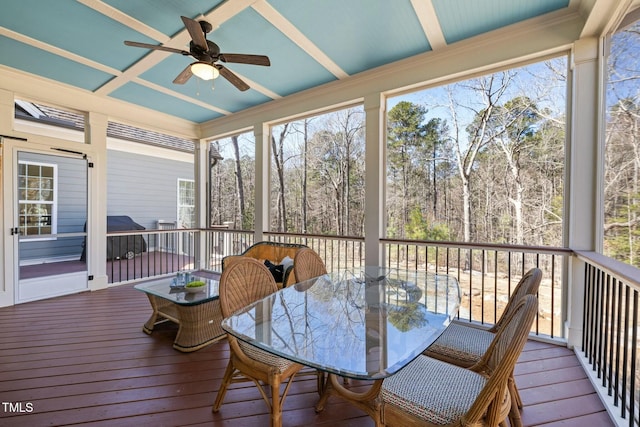 sunroom / solarium featuring ceiling fan and coffered ceiling