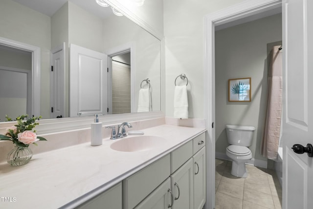 full bath with tile patterned flooring, baseboards, vanity, and toilet