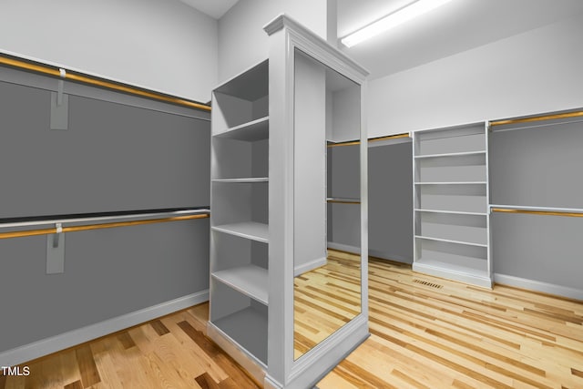 spacious closet featuring wood finished floors