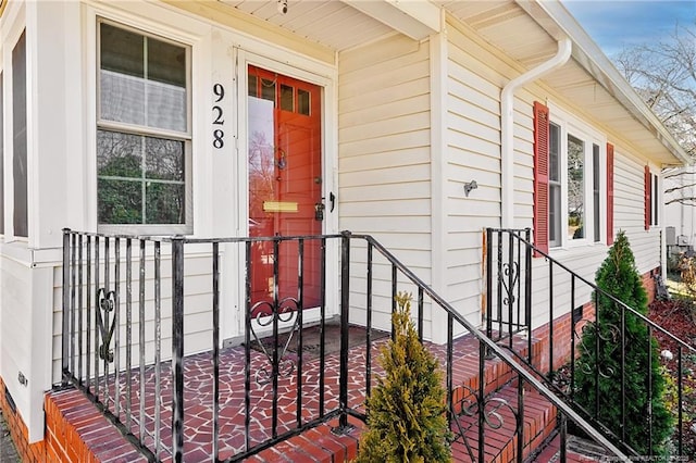 view of exterior entry with covered porch