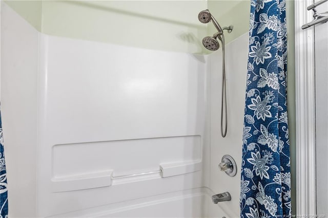 bathroom featuring shower / tub combo with curtain