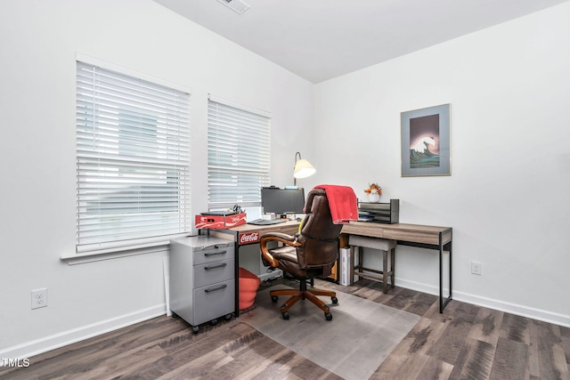 home office featuring visible vents, baseboards, and dark wood-type flooring