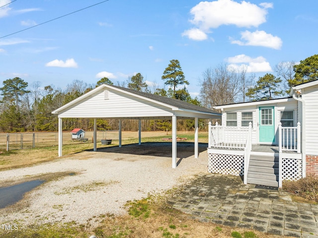 view of vehicle parking featuring a carport