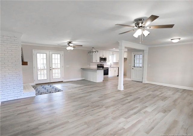 unfurnished living room featuring ornamental molding, french doors, ceiling fan, and light wood-type flooring