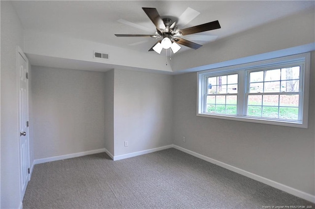 empty room featuring baseboards, a ceiling fan, and carpet flooring