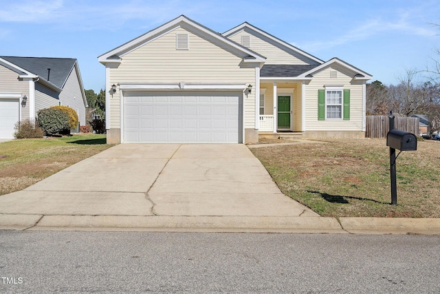 view of front of home with a front yard and a garage