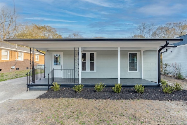 ranch-style home with covered porch