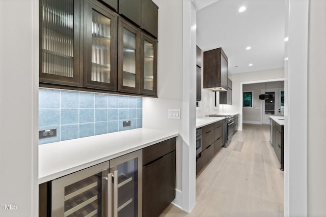 2305 Turners Aly, Raleigh, NC 27607 - bar area with wine cooler, appliances with stainless steel finishes, tasteful backsplash, light wood-type flooring, and recessed lighting