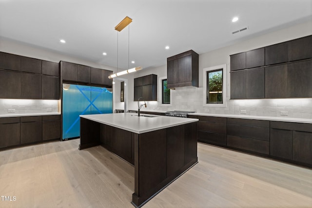 2305 Turners Aly, Raleigh, NC 27607 - kitchen with modern cabinets, light wood-style floors, light countertops, tasteful backsplash, and recessed lighting