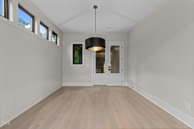 2305 Turners Aly, Raleigh, NC 27607 - unfurnished dining area with light wood-type flooring and baseboards