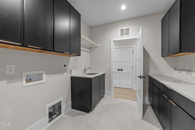 2305 Turners Aly, Raleigh, NC 27607 - washroom with cabinet space, washer hookup, electric dryer hookup, recessed lighting, and light tile patterned flooring