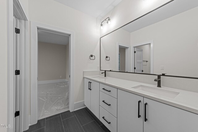 2305 Turners Aly, Raleigh, NC 27607 - bathroom featuring double vanity and baseboards