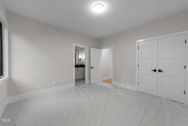 2305 Turners Aly, Raleigh, NC 27607 - unfurnished bedroom with carpet floors, a closet, and ensuite bath
