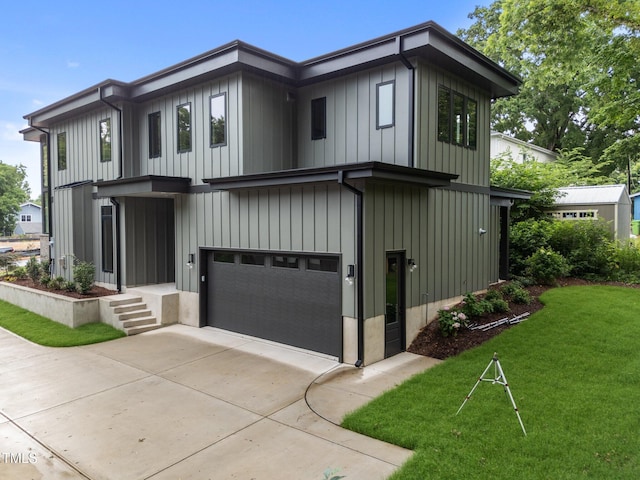 2305 Turners Aly, Raleigh, NC 27607 - view of front of home with a garage, a front lawn, driveway, and board and batten siding