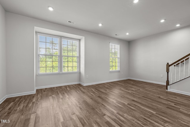 1414 Excelsior Grand Ave, Durham, NC 27713 - unfurnished living room featuring wood finished floors, stairway, recessed lighting, and baseboards