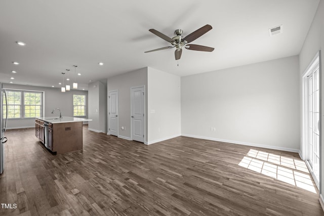 1414 Excelsior Grand Ave, Durham, NC 27713 - unfurnished living room with a ceiling fan, dark wood-style flooring, baseboards, recessed lighting, and a sink