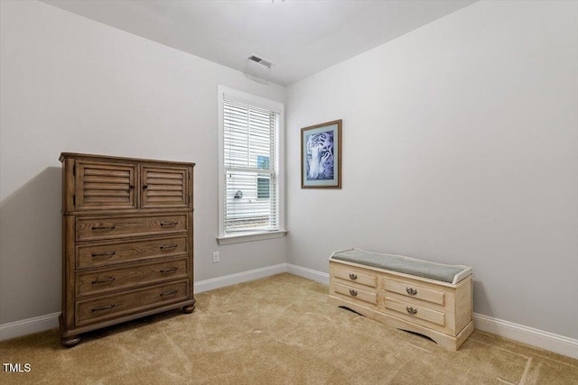 misc room with light carpet, visible vents, and baseboards