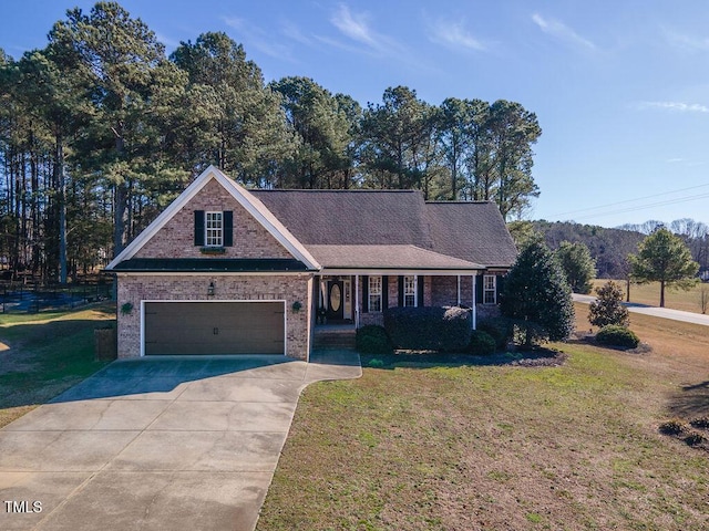 view of front of property with a porch, a garage, brick siding, concrete driveway, and a front lawn