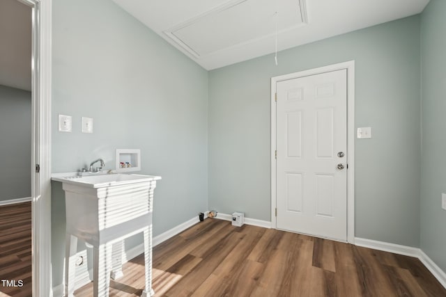 washroom with laundry area, attic access, baseboards, wood finished floors, and hookup for a washing machine