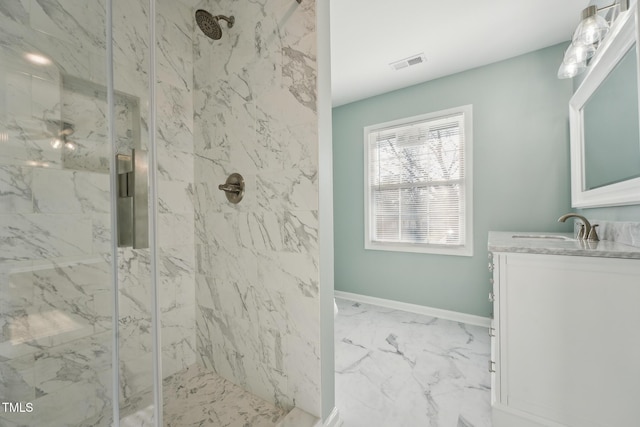 bathroom featuring marble finish floor, visible vents, baseboards, and a marble finish shower