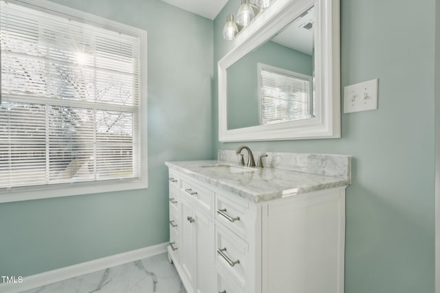 bathroom with marble finish floor, visible vents, vanity, and baseboards