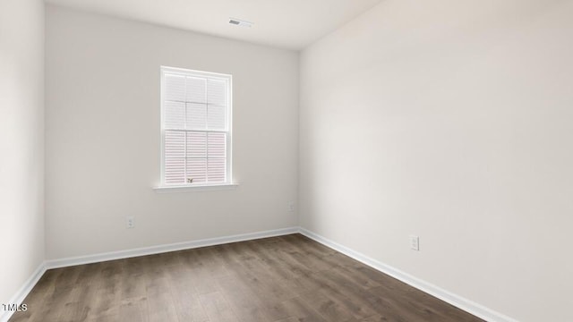 139 Ethel Ln, Angier, NC 27501 - empty room featuring dark wood-style flooring and baseboards