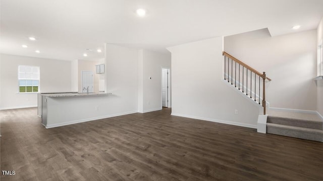 139 Ethel Ln, Angier, NC 27501 - unfurnished living room with stairs, dark wood-type flooring, baseboards, and recessed lighting