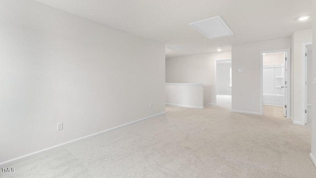 139 Ethel Ln, Angier, NC 27501 - spare room featuring attic access, light carpet, and baseboards