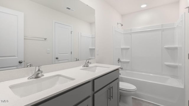 139 Ethel Ln, Angier, NC 27501 - bathroom featuring toilet, double vanity, washtub / shower combination, and tile patterned floors