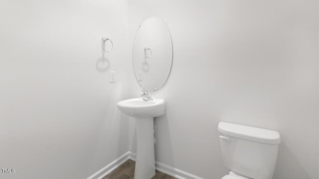 139 Ethel Ln, Angier, NC 27501 - bathroom with toilet, wood finished floors, and baseboards