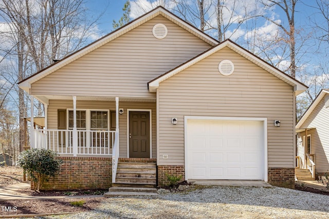 view of front facade with covered porch and an attached garage