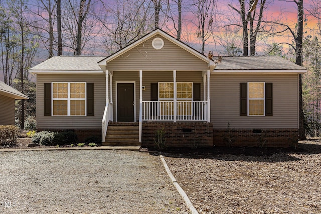 view of front facade featuring a porch and crawl space