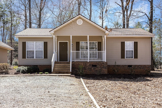 view of front facade with a porch and crawl space