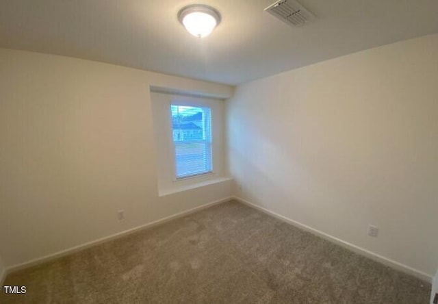 view of carpeted spare room