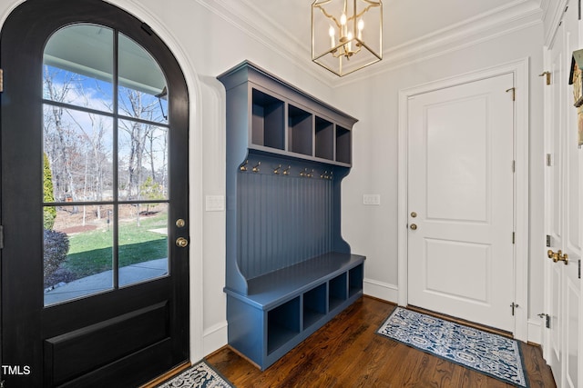 mudroom featuring arched walkways, a chandelier, dark wood finished floors, and crown molding